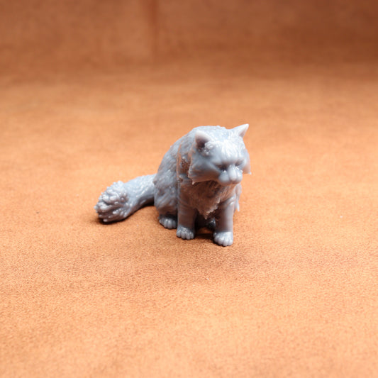 White cat figurine on a brown surface
