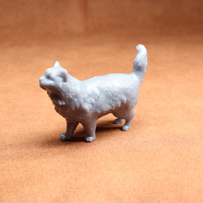 White 3D-printed cat figurine on a brown surface
