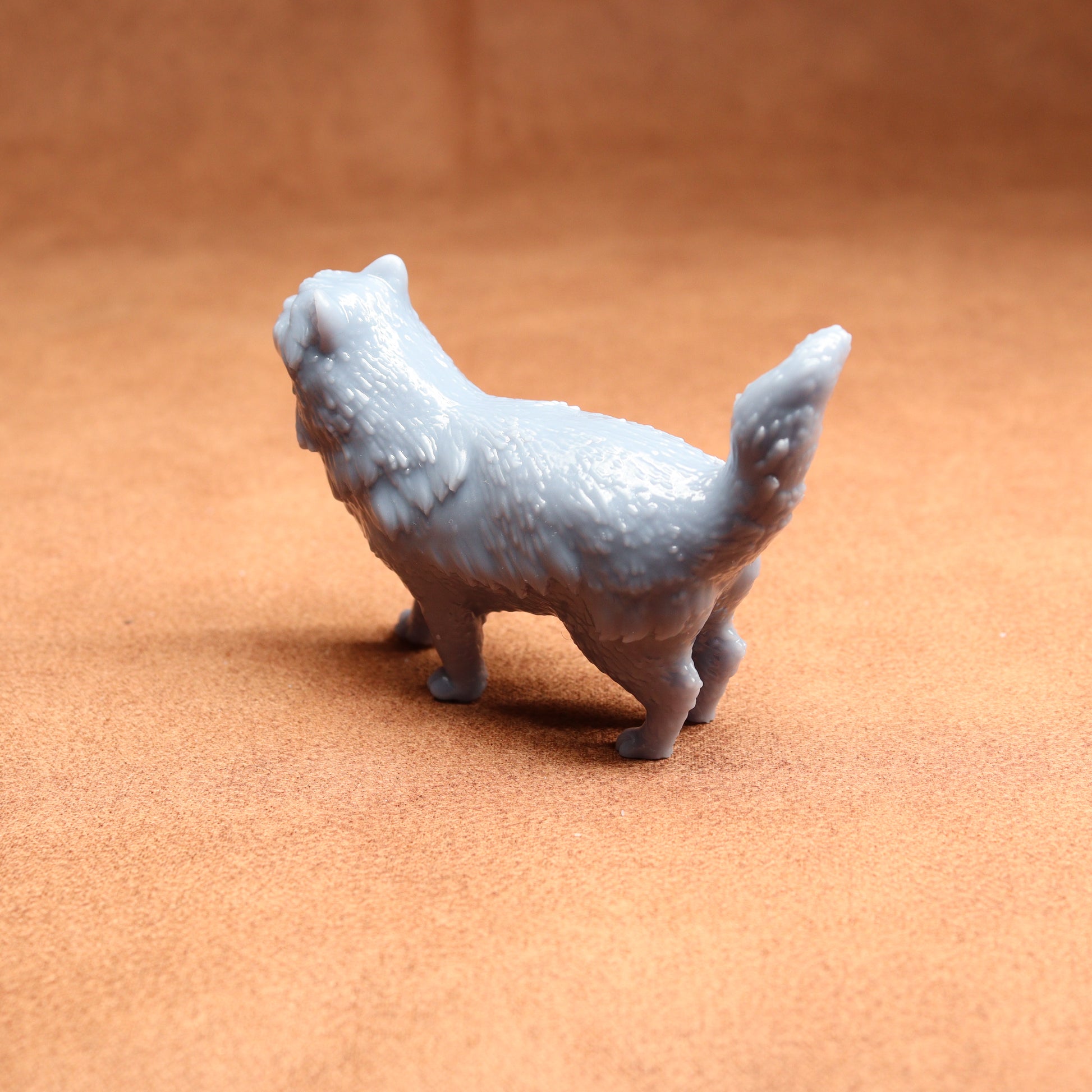 White dog figurine on a brown surface