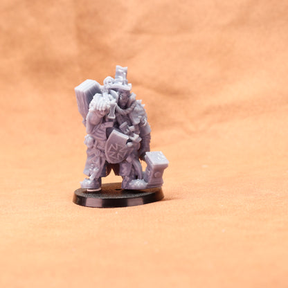 Gray miniature figure on a round base against an orange background