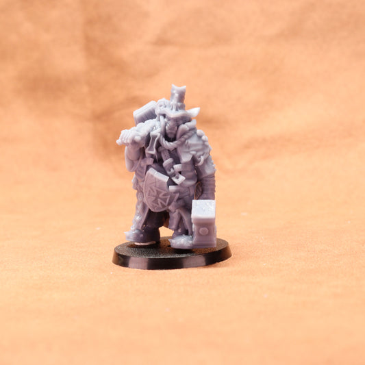 Gray miniature figure on a black base against an orange background