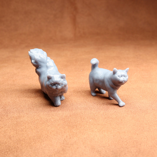 Two small white animal figurines on a brown surface