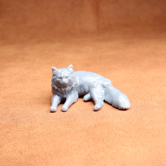 White cat figurine on a brown surface