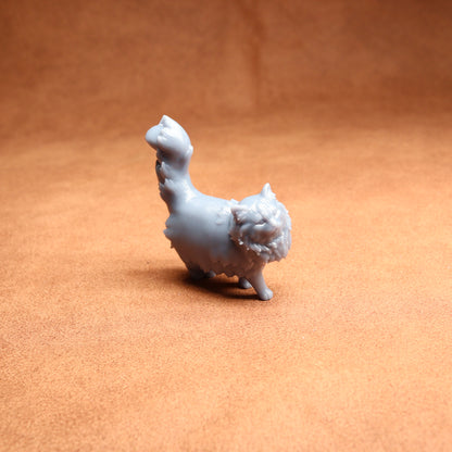 White ceramic llama figurine on a brown surface