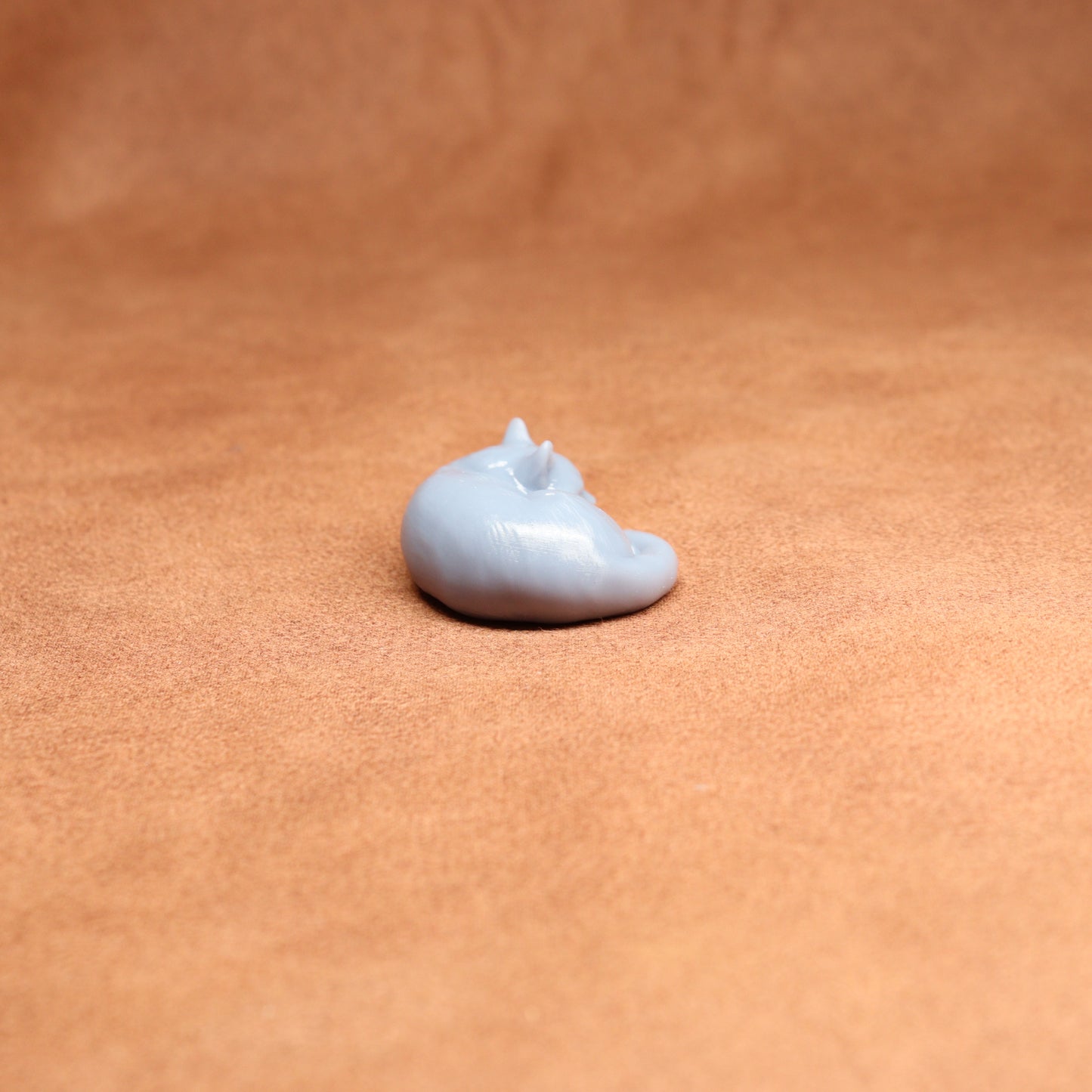 Small white object on a brown surface