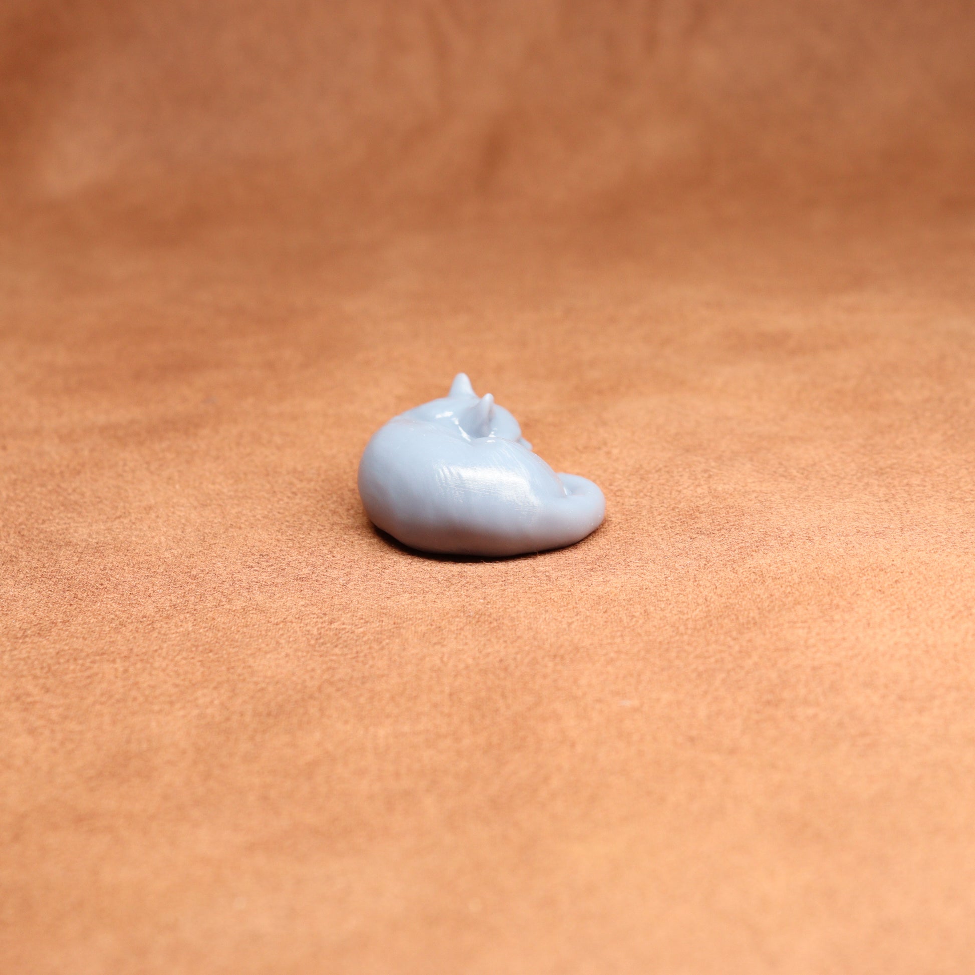 Small white object on a brown surface