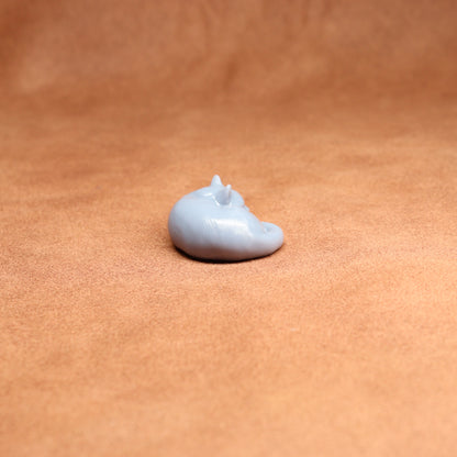Small white object on a brown surface