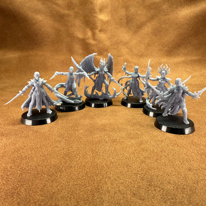 Set of fantasy miniatures on a brown surface