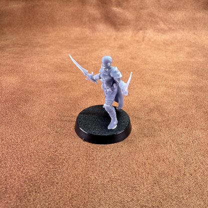 Miniature figurine on a round black base against a brown textured background