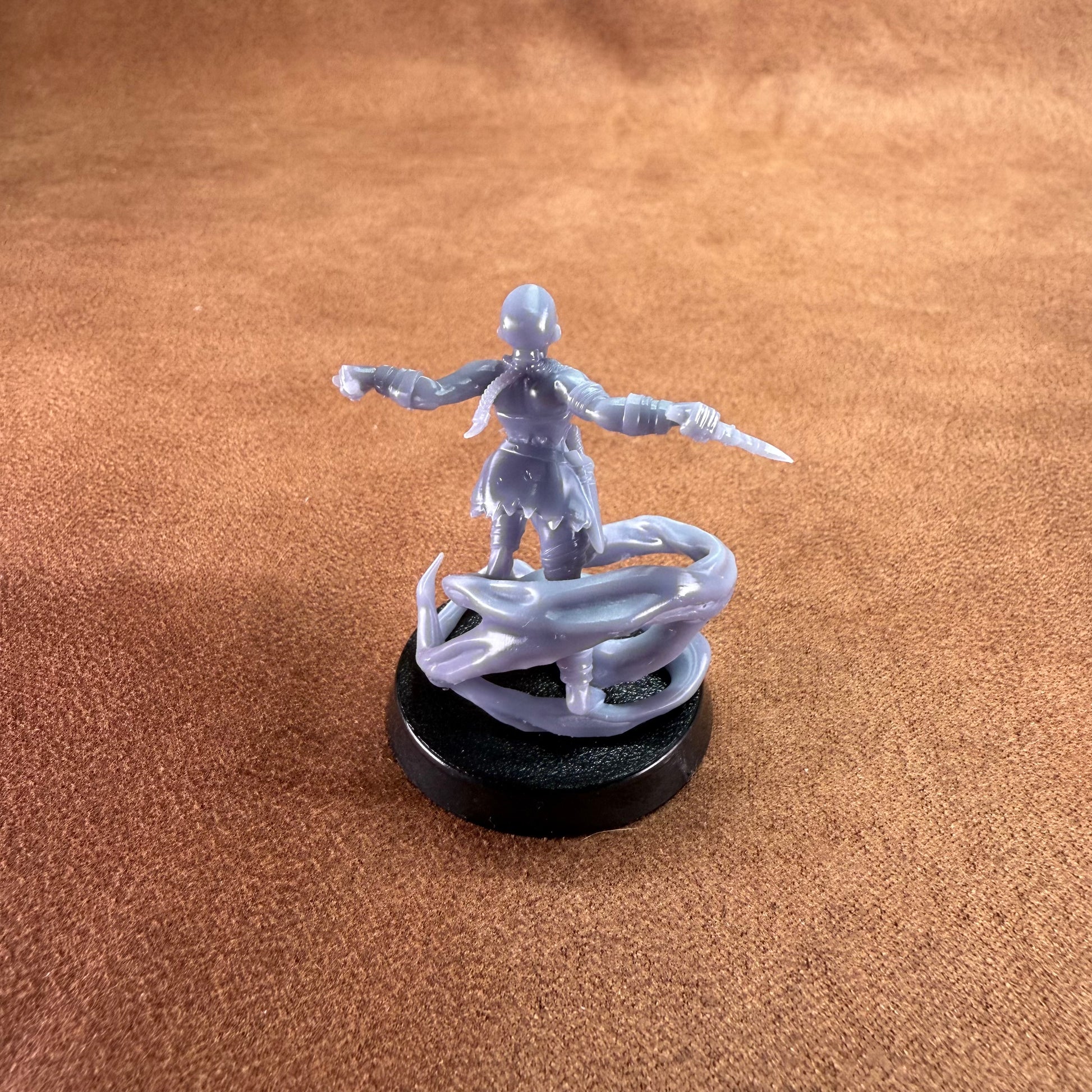 Game figurine with a character and dragon on a brown surface