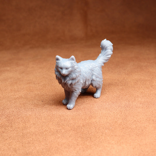 White cat figurine on a brown surface