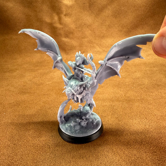 Dragon figurine on a brown textured background
