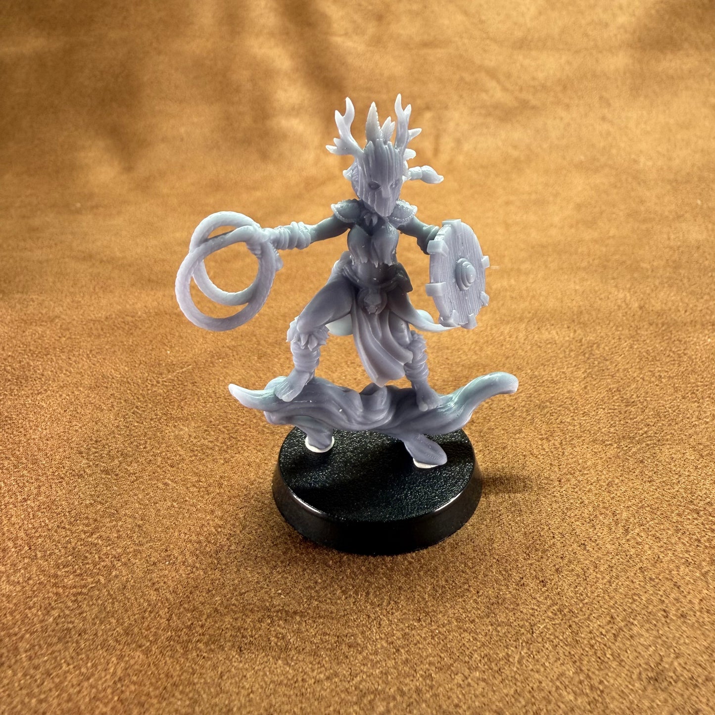 Fantasy figurine on a brown surface