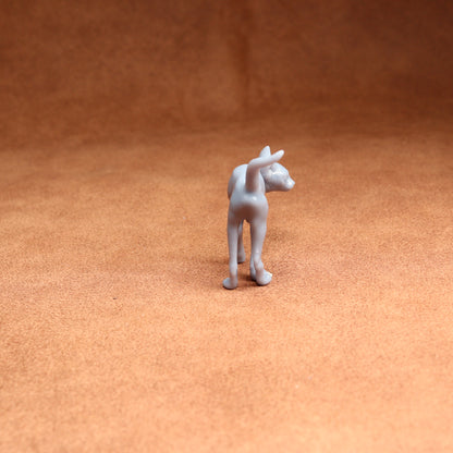 White dog figurine on a brown surface