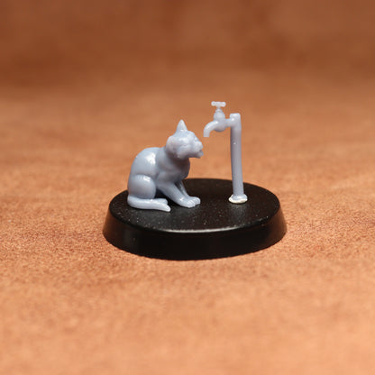 grey cat resin miniature on a black base on a brown background.