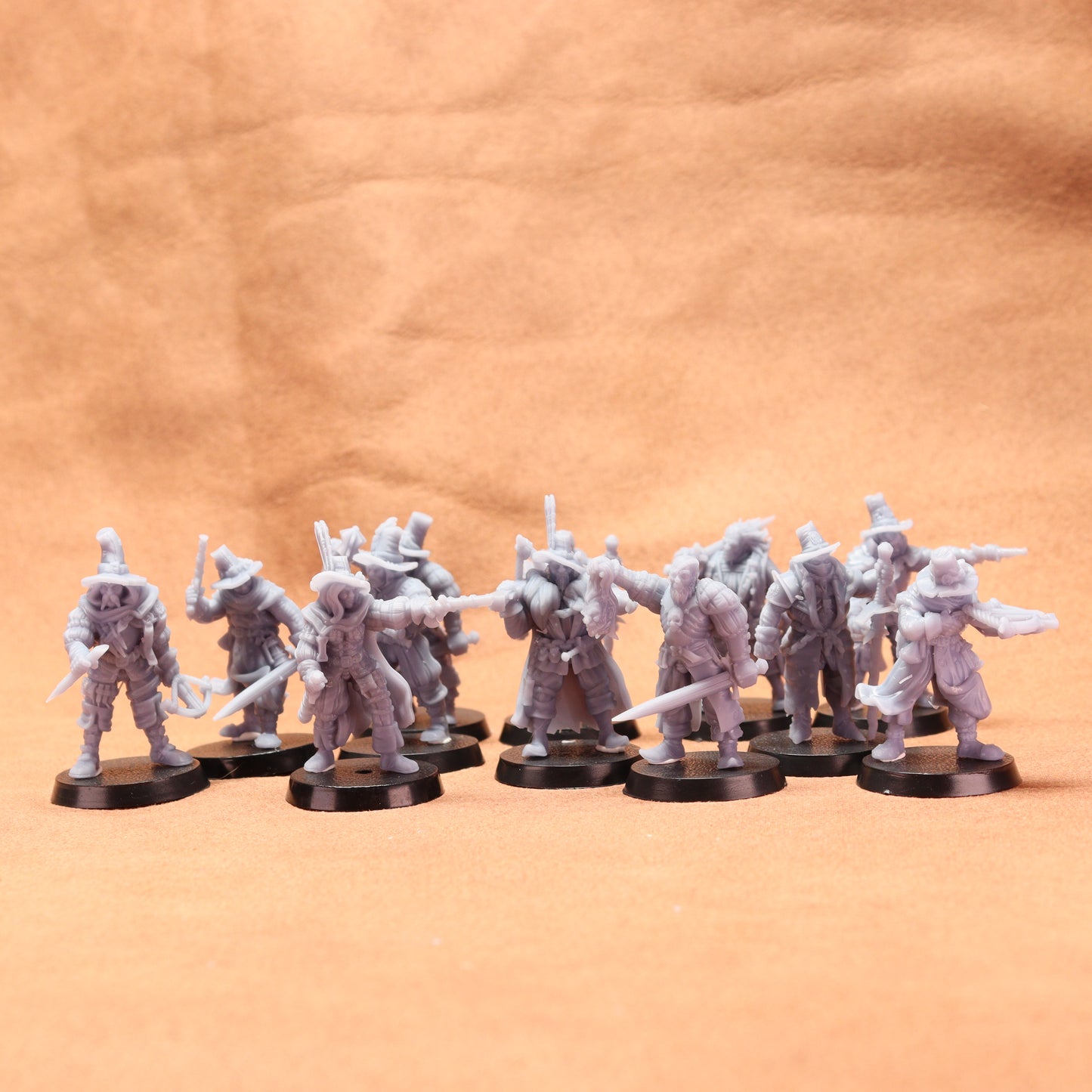 Set of miniature figures on a textured orange surface