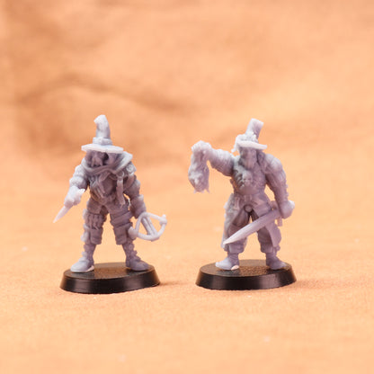 Two miniature figurines on a beige background