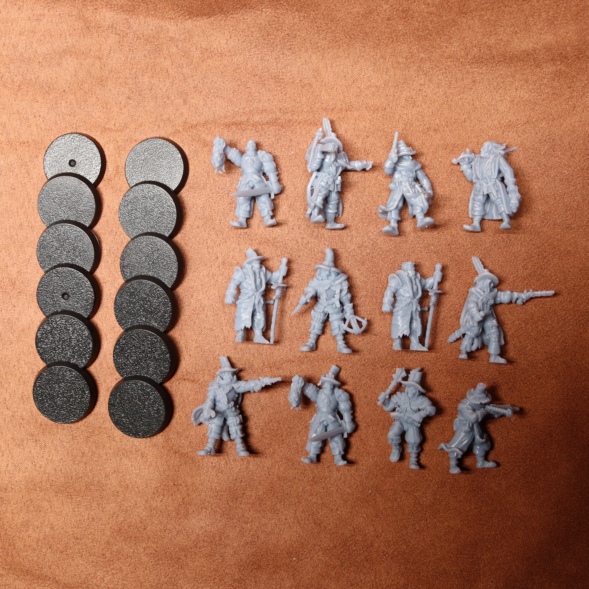 Set of miniature figures and round markers on a brown surface