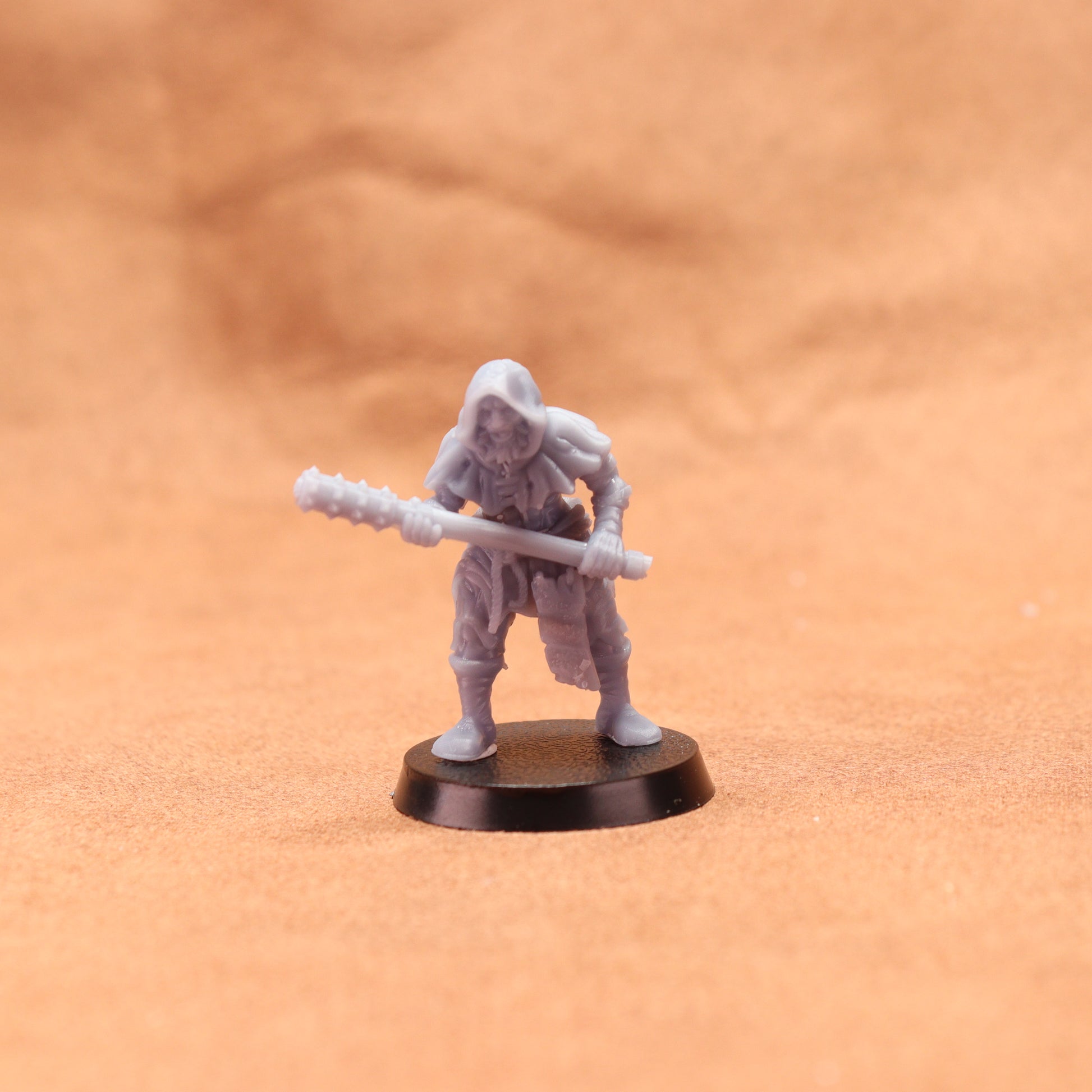 Miniature figurine on a brown surface