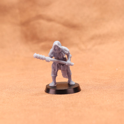 Miniature figurine on a brown surface